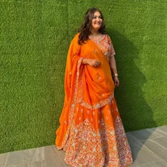 A subtle and sunny bridesmaid look. I kept the makeup soft and dewy with a half-up, half-down wavy hairstyle to match the vibrant orange lehenga.