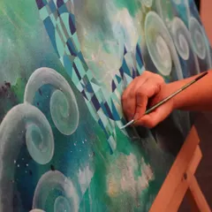 A close-up of my brushwork on the "Life Below Water" painting. Each stroke is precise, building up the geometric patterns and swirling blues that define the piece. This is where the vision starts to become a reality.