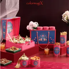 This vibrant pink and blue hamper set is a modern take on festive gifting. It includes a large box with ornate metal jars for treats and a matching gift bag, perfect for making a memorable impression.