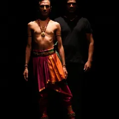 A powerful stage image from "Tatsama Tadbhava." The stark lighting and minimalist costumes focus attention on the raw emotion and physical storytelling of the piece.