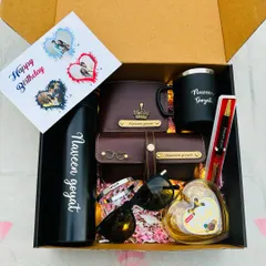 This birthday hamper is packed with style. It includes a personalized temperature bottle, mug, wallet, and sunglass holder, along with sunglasses, a heart-shaped chocolate box, and a custom birthday card.