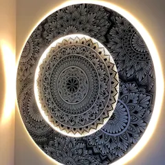I love adding a touch of magic with backlighting. This custom layered mandala features a warm LED glow, turning the intricate artwork into a stunning light fixture that transforms the room's ambiance.