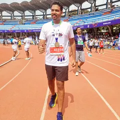 A proud walk on the stadium track after finishing a full marathon. The look of accomplishment says it all. Our group provides the motivation to keep going, even when it gets tough.