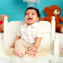A big, happy laugh from this little one. These joyful, candid moments are what make milestone sessions so special.