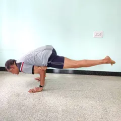 Eka Pada Galavasana (Flying Pigeon Pose). This arm balance combines a deep hip opening with the challenge of balancing on the hands. It requires both strength and flexibility.