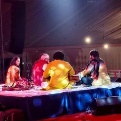 A candid moment on stage during the Mahakumbh festival. The connection between artists during a live performance is what creates musical magic.
