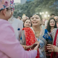 The mothers from both sides sharing a laugh. These are the moments where two families become one.