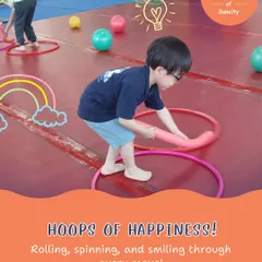 Hoops of happiness! We use simple props like hula hoops and balls in creative ways to develop motor skills and keep the energy high.