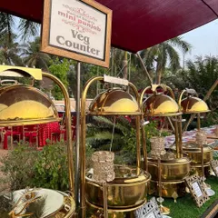 Another angle of our stunning veg counter at an outdoor event. The combination of traditional brass-finished serveware and natural elements creates a look of rustic luxury.