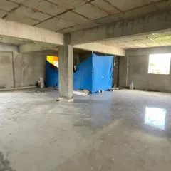 Another angle of the bare site. Understanding the existing structure is crucial for planning electricals, lighting, and the placement of large display units and consultation areas. Every kona, or corner, holds potential.