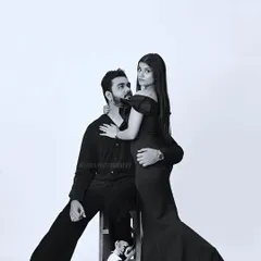 An intimate and artistic pose from the same black and white studio session, highlighting the couple's connection.