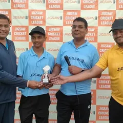 Presenting an award at the Jigsaw Cricket League. Recognizing individual performance is key to building a strong team.