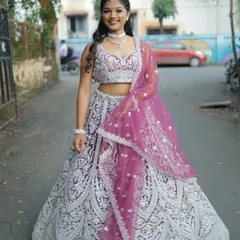 A beautiful wine colored lehenga with heavy silver embroidery. It's a rich and elegant option for a Sangeet or engagement party.