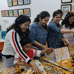 The joy of celebrating together! Our students and instructors having a blast with flower petals during our eco-friendly Holi celebration.