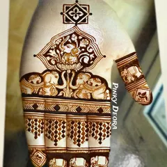 A close-up of a traditional design featuring Lord Ganesha and majestic elephants. This style is perfect for brides who want a rich, heavy look filled with auspicious symbols.