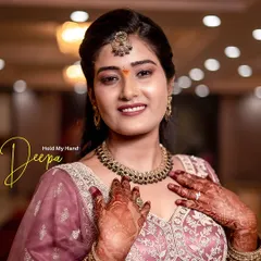 A close-up of Deepa, highlighting her intricate henna, jewelry, and joyful expression. These portraits are all about capturing the bride's happiness.