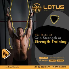 Grip strength is the foundation of all heavy lifting. This image of a member on gymnastic rings highlights its importance in strength training, from pull-ups to deadlifts.