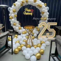 An elegant white and gold balloon ring with '25' marquee numbers, perfect for celebrating a silver jubilee anniversary.