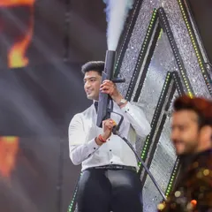 When the groom is a true 'Hero No. 1'. This shot captures the peak energy of his sangeet performance, complete with a CO2 gun to hype up the crowd.