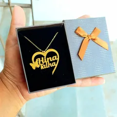 Here is another view of the heart-shaped couple's name pendant, shown inside its gift box. The presentation makes it a ready-to-give gift for any special occasion.