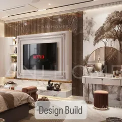 A master bedroom should be a personal sanctuary. In this Gurgaon villa, we used a blend of fluted marble, rich textures, and custom millwork to craft a space of modern elegance. The integrated TV unit and the bespoke vanity with its statement mirror demonstrate our focus on combining flawless function with high-end design.