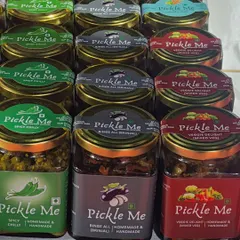 Our vegetarian pickle range includes unique flavours like Spicy Chilly, Binge All (Brinjal), and the classic Mixed Veg. Each one is a testament to our commitment to homemade quality.