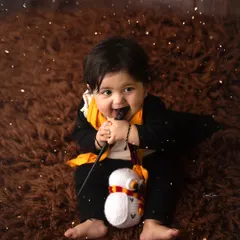 Love at first sight! This little Harry Potter is casting a spell on all of us with his adorable smile and magic wand.