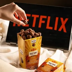 Chocolate popcorn from Paul & Mike, styled for a "Netflix and chill" theme. This tells a story about how to enjoy the product.
