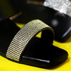This detailed shot of a Dressberry sandal highlights the sparkling strap and sleek design. I use bold, contrasting colors and sharp lighting to create striking e-commerce and fashion accessory images that grab attention.