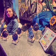 My walls say otherwise. A powerful shot from a pop-up event, surrounded by my resin art, speaking out against the stereotypes faced by women in the art world. I'll keep painting and letting my work do the talking.