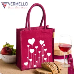 Our capabilities include producing fully dyed jute bags in your brand's specific colors. This vibrant magenta tote, shown with a custom heart print, is an excellent example of a personalized gift bag suitable for special occasions or as branded merchandise.