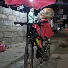 A cycle parked next to a street-side golgappa vendor near Kundalahalli. Our impromptu rides often end with satisfying our cravings for local street food.