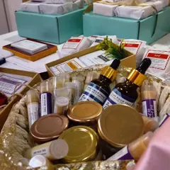 This basket is full of possibilities for your custom hamper. It shows a mix of my Rosemary & Peppermint Hair Oil, various lip balms, and body butters, ready to be combined into a thoughtful self-care kit.