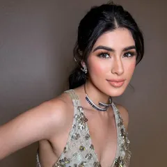 A close-up of a soft glam look perfect for a cocktail party. The makeup features a gentle smokey eye, luminous skin, and a glossy nude lip for a sophisticated and polished finish.