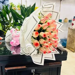 A beautiful bouquet of two-toned pink and white roses. This is a popular choice for birthdays, thank you gifts, or for celebrating a new baby.