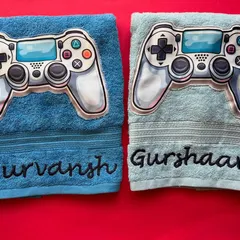 Game on. These personalised towels with a video game controller patch are perfect for the little gamer in your life. We'll embroider their name underneath for a custom touch.