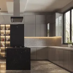 A stunning island kitchen designed for a modern home. The black granite island provides a bold centerpiece, while the grey cabinets and terrazzo-style backsplash with under-cabinet lighting create a sophisticated look.