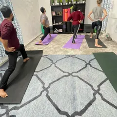 A snapshot from one of my group classes in Delhi. I guide a small batch of students through Virabhadrasana I, or Warrior I pose. I focus on correct alignment for each person to ensure they build strength safely and effectively.