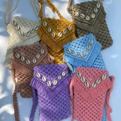 Our mobile slings are an obsession for a reason. Available in a rainbow of colors like mustard, brown, purple, and pink, these shell-detailed slings are stealing hearts everywhere.