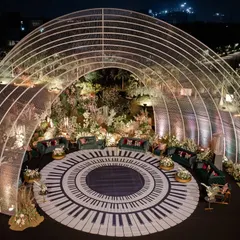 I designed this unique musical-themed reception around a grand piano-key dance floor, enclosed within a dramatic arched structure. It was a night where every detail was in perfect harmony, creating a visual and sensory masterpiece.