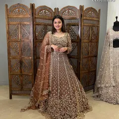 This bronze-gold lehenga is all about heavy embroidery and glamour. It’s a fantastic choice for a bride's sangeet or a guest.