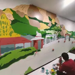 My team and I executing a large-scale mural for MIPL, celebrating the local culture of Bangalore with Anekal Gudi dolls. Weaving local stories into MNC spaces makes them feel warm and rooted.