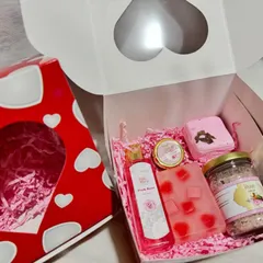 My Valentine's Day hamper is filled with rose-themed skincare goodies. It includes a 3D heart soap, a rose bath bomb, organic lip balm, rose bodywash, and rose bath salts.