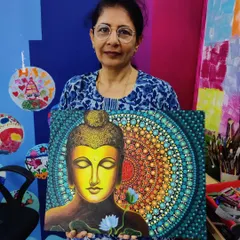 A participant proudly displays her stunningly detailed Buddha painting, a combination of acrylics and dot mandala art on canvas. This piece highlights the serene and meditative outcomes possible in my adult workshops, perfect for anyone looking to reconnect with their creativity.
