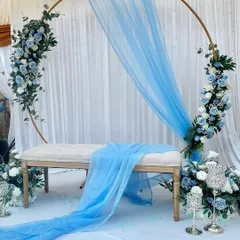 This is one of my favorite setups, perfect for a dreamy and elegant engagement. I used a delicate palette of blue and white florals on a golden circular arch, with a light, airy drape to create this beautiful look. It’s a simple yet stunning backdrop that feels both modern and romantic.