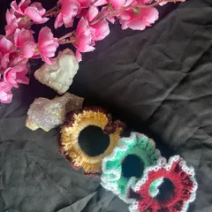 A closer look at the handmade scrunchies. The ruffled design makes them look full and fluffy in your hair, and the crochet texture is super soft so it won't pull or snag.
