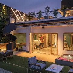 The second-floor bar in the Screen House opens up to this sprawling terrace garden. The fluid transition between interior comfort and outdoor tranquility makes it the perfect setting for gatherings or quiet reflection.