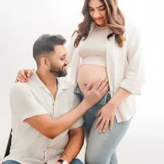 The look of adoration from a partner says it all. This bright, high-key studio setup is perfect for creating clean and joyful couple portraits in casual attire.