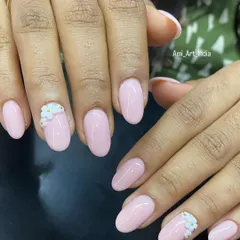 A simple and elegant set of pink nails with a beautiful 3D flower accent. The small details make all the difference.