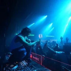 Getting up close with the crowd at a packed club show. Crowd interaction is a huge part of my set; I'm on the mic, hyping everyone up and sharing the energy directly from the console.
